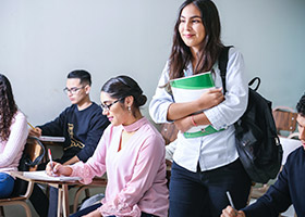 Student going through the letter of acceptance and medical insurance with an adviser