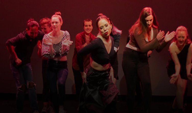 Students of the Australian Performing Arts Conservatory rehearsing on stage in Brisbane