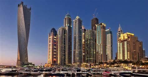 Dubai skyscrapers by the marina at sunset